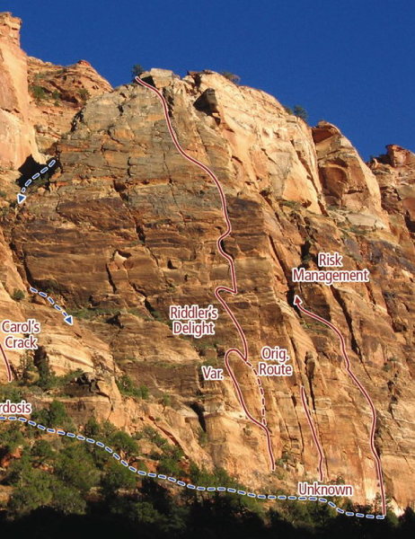 Riddler's Delight climbs the green-lichened face above the Zion Lodge