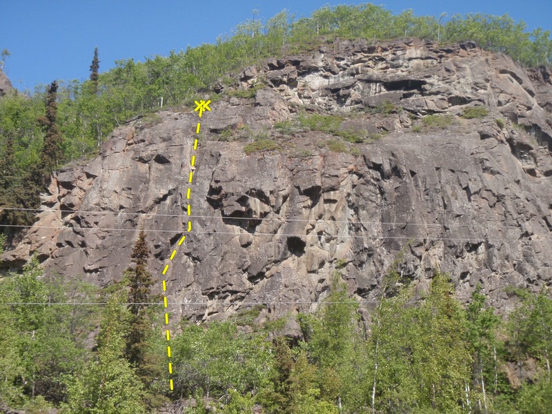 Shakti climbs under the smaller blocky roof and into the dihedral.