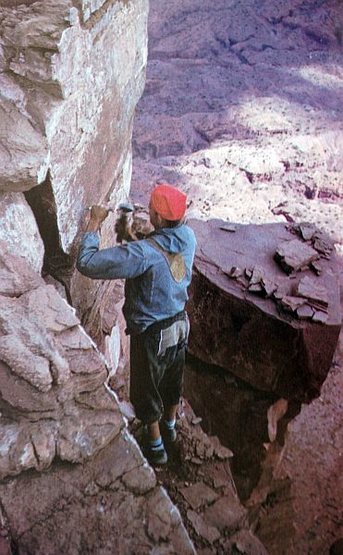 Layton Kor drilling a bolt on the FA of Castleton Tower, Castle Valley<br>
<br>
Photo by Huntley Ingalls