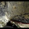 route on the north side of Overflow Dome.  sandbagged at 5.10+.  gear to two bolts.  looking down from the rest before the crux sequence.  