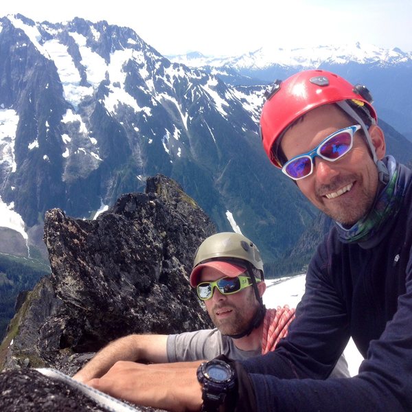 Three can barely fit on the tiny summit of the Aiguille de l'M, Boston Basin, North Cascades National Park