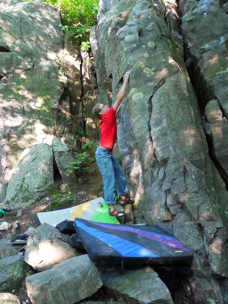 Earth Mechanics. This is the crux move if you don't use the semi detached blocky feet under the start edge. Bumps to V6ish this way.