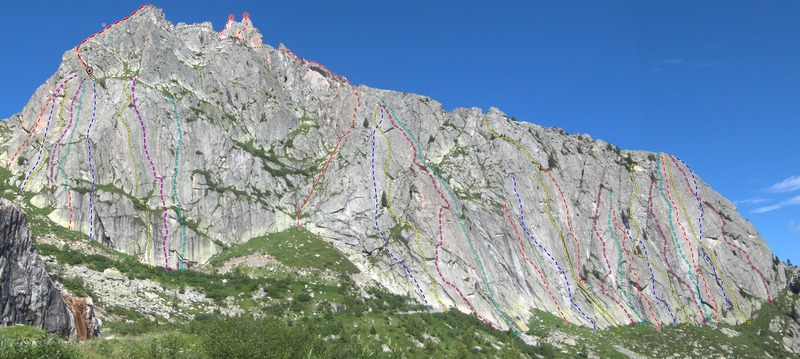 Overview of Spazzacaldeira, with the famous La Fiamma and Il Dente on the ridge. <br>
<br>
1. Fiamma Via Sud 6a+ 8p<br>
2. Seifert 6b+ 3p<br>
3. Nebel des Grauens 7a (6b+ A0) 3p<br>
4. Via Leni 6a 5p<br>
5. Va Col Vento 6c+ 4p<br>
6. Tiramisu 6b 4p<br>
7. Piache Inferiori 7a (6b A0) 2p<br>
8. La Stria 6b<br>
9. Lasciamili 6a 7p<br>
10. Buttamigiu 6b 5p<br>
11. La Sirena 7a+ (A0) 5p<br>
12. Militärgratli (SE-ridge) 4a<br>
13. La Fiamma 5c+<br>
14. Il Dente Normalweg 6b<br>
15. NE-ridge 4c<br>
16. Giovanne d'Italia 7b<br>
17. Dente per Dente 6a<br>
18. Via Felici 6a<br>
19. Coco Driller 7a<br>
20. Gioca il Jolli 7a+<br>
21. Kind of Magic 7a<br>
22. Nasi Goreng 6a<br>
23. Golden Pillar 7a<br>
24. Teorie del Cele 6b+<br>
25. La Dama 7a<br>
26. Benno 6b<br>
27. Peperina 6a+<br>
28. Andamento Lento 5c<br>
29. Excalibur 6c<br>
30. La Colazione 7a+<br>
31. Daccapo 7a<br>
32. Steinfresser 6a+<br>
33. Gi-Emme 7a<br>
34. Nuova Via per Claudia 6a+/6b<br>
