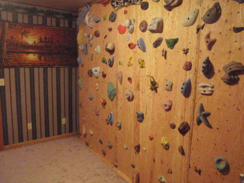 The wall can swing from vertical to 60 degrees overhanging. There are three ropes attached to the top of the wall that are in line with the hinges at the base. This transfers the load through the structure. Even on the most dynamic moves there is no wall flex.