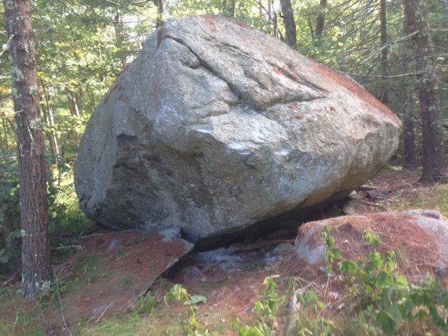 Sit between pedestals. Starting holds are visible.