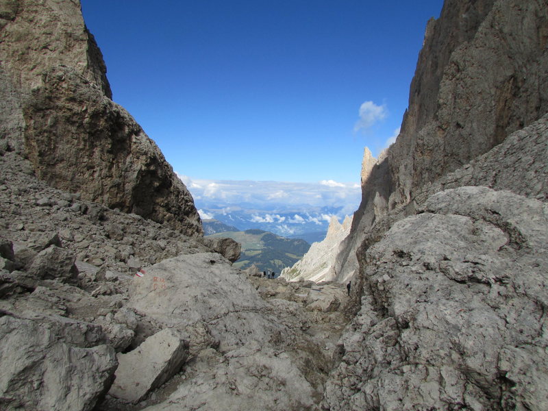 There's a fairly good trail system in the Dolomites, and a good but steep trail ascends from the Comici Hut to the Langkofelscharte. This view is looking down the valley towards Wolkenstein (Selva).
