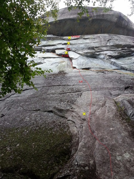 Much of the climbing (about 60') is out of sight above the roof. Bolts are marked on the lower half but not the 3 out of sight. Also, the # 4 is now unnecessary after the placement of a bolt just above the corner on the lower half (marked here).