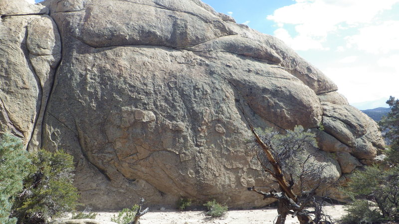 Double dome west face with obvious hourglass cracks. This is the first face visible when hiking in from above it.