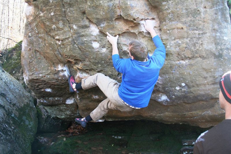 Jim on All For V4 on the River Boulder. This problem is left of The Best V5 in MN. Start on whatever is comfy, hike your feet up, and don't stop. Goes up and then right around arete to bomber pocket for finish. Wipe off your feet before every attempt, this problem is over a sand bar. Climbing with sandy shoes will degrade the rock quality, don't do it! Sometimes can't be climbed due to water levels. Don't climb wet rock here!