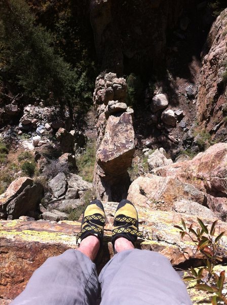 Dangling the toes over the edge after the top-out.