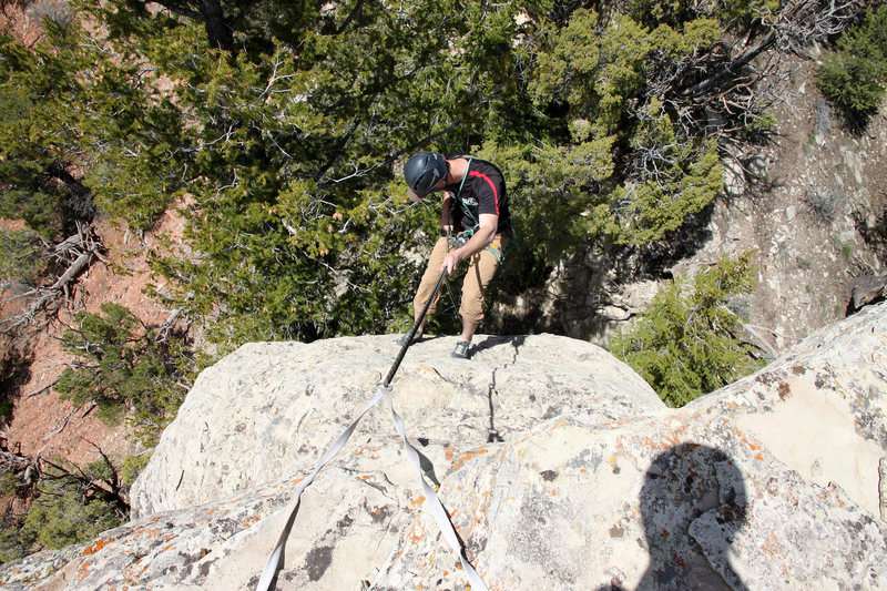 Mike Santoro rappeling off the north face using the original webbing and rap ring left by J & Jesse on their 1st ascent.
