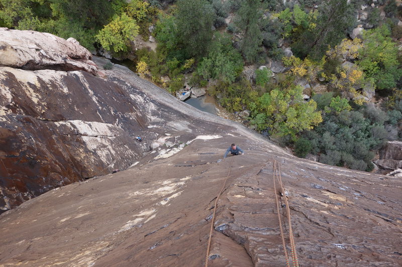 Moving out and over the roof and getting ready to start the thin face climb towards the top of the second pitch.