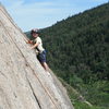 Jonah Chalnick climbing the upper slab on South Bubble Mountain in Acadia National Park 