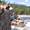 Dad and Daughter Climbing Otter Cliffs 2014. With Dorr Mnt. in the back-round and waves crashing below, this makes for a very dramatic photo.