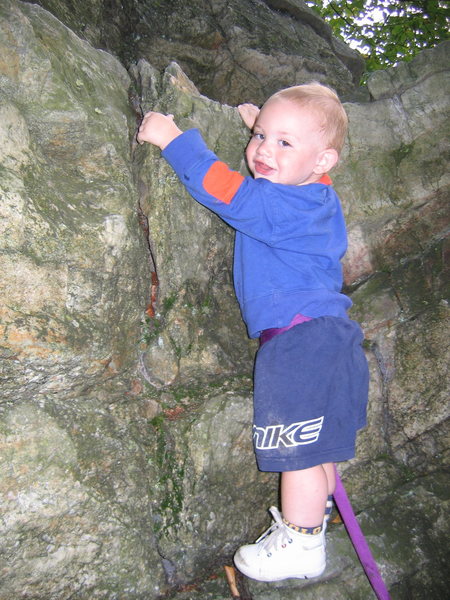 Jonah Chalnick 2 years old learning to climb on boulders in the Gunks.