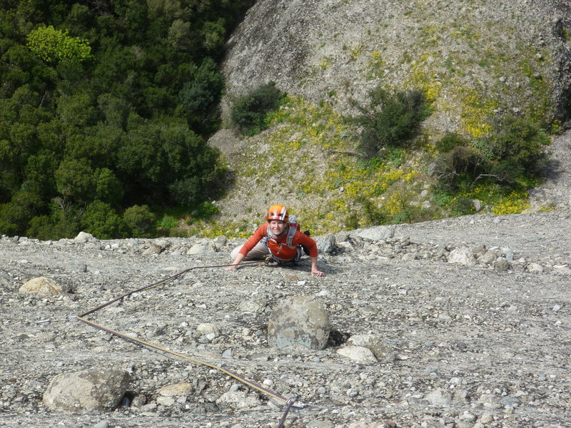Jitka following the 3rd or 4th pitch of Sophokles. There are quite a few horizontal bands of larger cobbles on this tower, which make for some good stances.