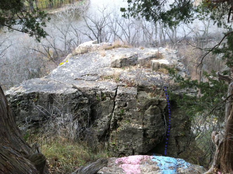 You have to anchor on the area were the picture was taken. You can redirect the anchoring ropes from the top rocks but would not trust them as sole supports. Crossing the chasm for top setup is a tricky class 4 scurry about 12' high.