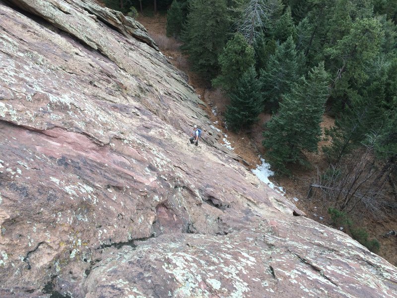 Looking down from a full rope-length up. My partner just cleared the crux bulge.
