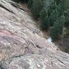 Looking down from a full rope-length up. My partner just cleared the crux bulge.