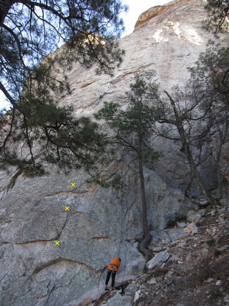 Start of route marked w stick and the 1st 3 bolts. <br>
(Lin about to do Earth Angel.)