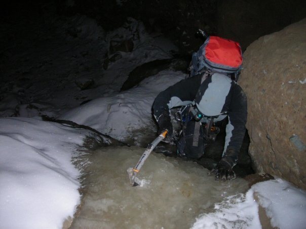 Ted downclimbing a lower section of Schoolhouse in the dark.