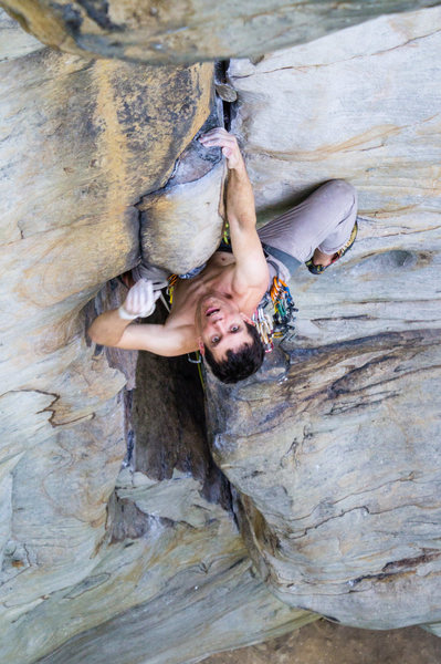 Warren Whipple leading Stuck In Another Dimension (11a) at Junkyard Wall. Photo by Jeff Dunbar.