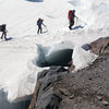 A party navigating a crevasse as they enter Camp Schurman