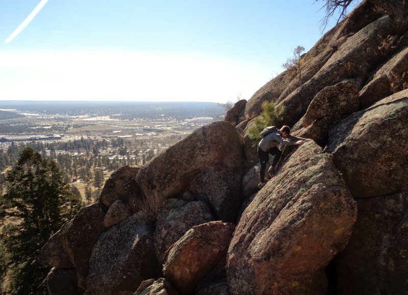 Scrambling up the boulders before getting on the slab proper