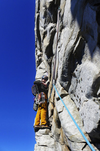 Level view of traverse for accurate perspective on past-vertical face above. Crux starts from very solid stance