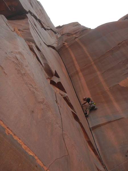 Past the first crux, psyched to be putting in a gold camalot