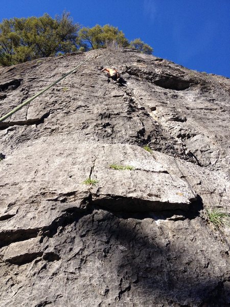 Working the first crux and cleaning many loose holds on Memories I've Never Had
