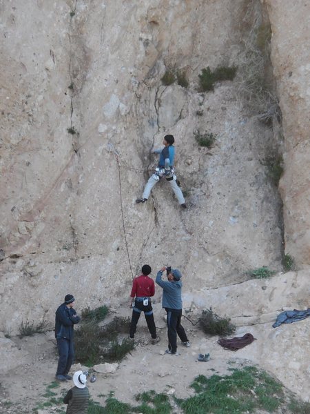 Climber sifting through the initial choss and friable holds on "Black Gold."<br>
The rock and the moves get better after climbing above the first couple bolts.