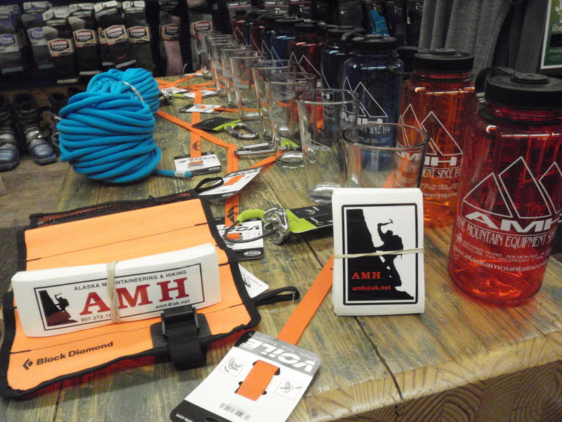 Alaska Mountaineering And Hiking has donated this table full of prizes to be given away at the Valdez Ice Fest!! We have Edelride locking biners, Megajul belay devices, Nalgene bottles, AMH pint glasses, Voile gear straps, Black Diamond Ice ScrewUp, and the grand prize a Beal Joker climbing rope!!! Along with prizes they will be running specials on ice climbing rental gear for the festival weekend. 36$ for boots, Crampons, and a Helmet package Feb 12th 17th!! Check them out at 2633 Spenard Rd, in Anchorage.<br>
AMH You guys are amazing!!!