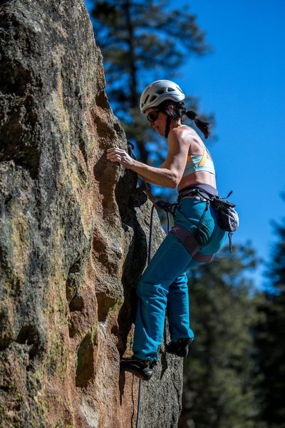 Pinching the neat tufa-like pinch at the top of the difficulties and before the slabby finish. February 2015. Aaron Lovato photo.