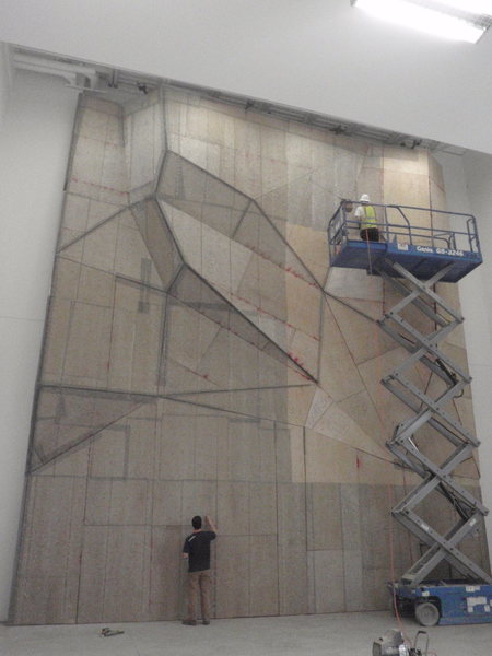 Sheeting the structure and stapling the steel mesh before applying texture.