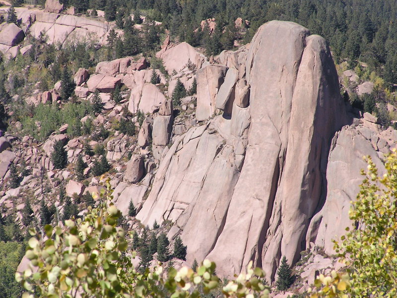 Scorpio Dome massif as seen from Balanced Rock road, climber can be seen on Scorpio Crack on upper left side of formation.