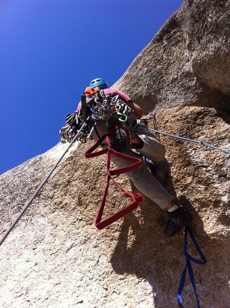 Bryan on the overhang that starts pitch 3. The tag line marks vertical.