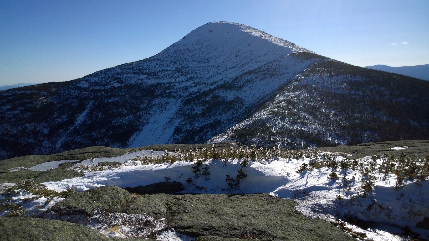 Algonquin peak in early march conditions as seen from the summit of