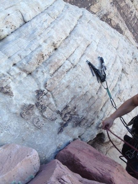 This rap station is somewhat hidden from above. I believe there are two more rappels after this to the ground.
