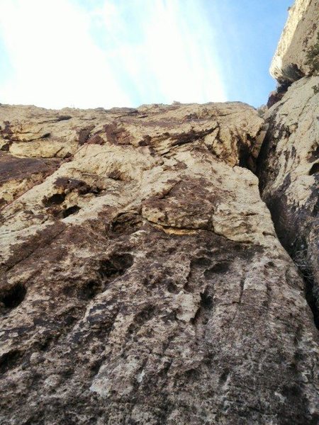 Looking up at the great finger crack at the start of Pitch 2. You can vaguely see the rope to the left of the frame.