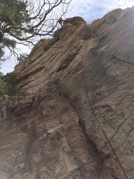 The second area at the One Day Wall. Juli is rapping from Last But Not Least (BC), and Spanish Fry (5.9 BC) is immediately to the left. These are the only two routes on this wall.