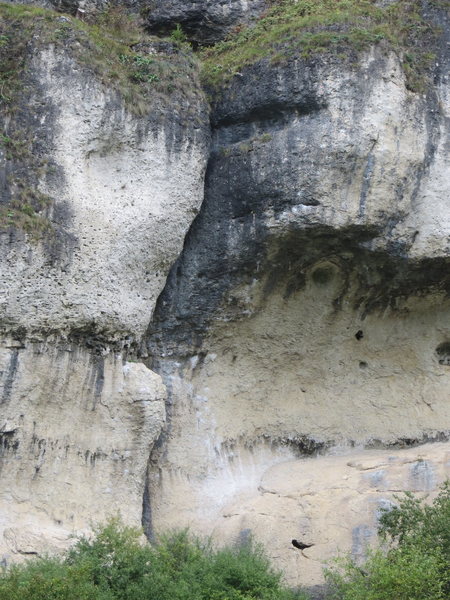 Herkules essentially follows the faint sun/shade line out the left side of the cave.  The line up the white prow left of the crack is Roter Baron.