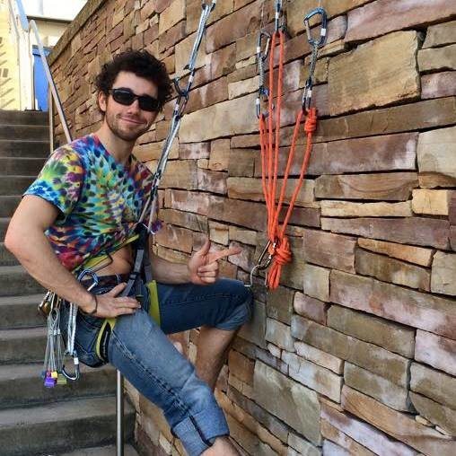 Practicing building mulitpitch trad anchors on a stone wall at WVU in Morgantown, WV.
