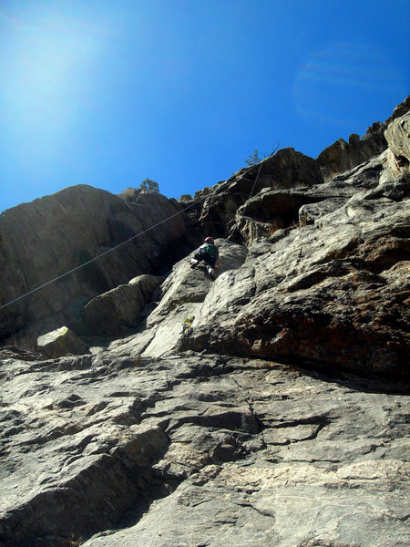 Deb climbs the footsy (crux, IMHO) section of the climb. The roof above feels harder than the Minnesota Gophers roof bit, as the holds are less positive.