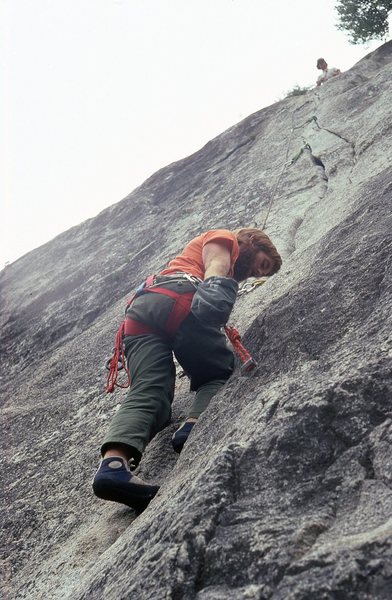 Chuck Wilfley following the second pitch with Paul Petersen at the belay. 1980.