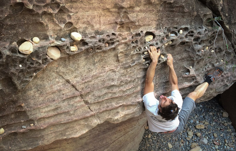 Matt in search of a V0 warmup on the Honeycomb Boulder....we hiked past this a good 5 or so minutes before finding easy slabs up.