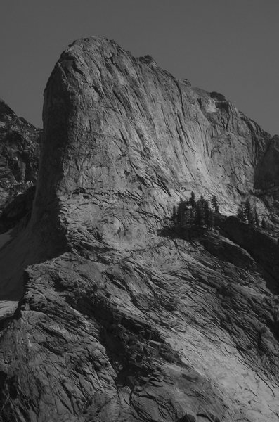 Hamilton Dome - North Arete almost follows the sun/shade line on the awesome North Buttress. North Arete Left Side (5.10a) (see new Secors) wanders into the far left side of the shaded buttress.
