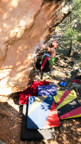 Eyeing the crux move to the pinch on My Fleshy Oslo.