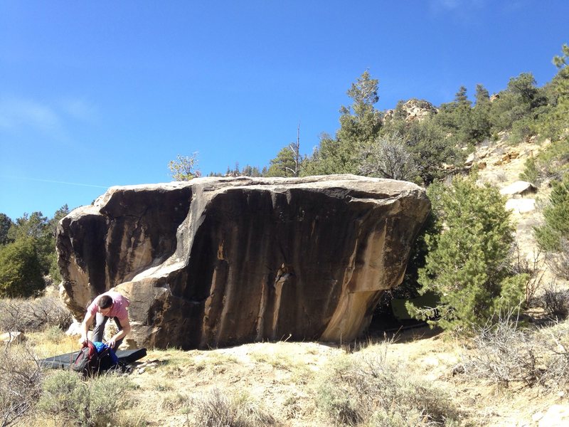 This is the first boulder that we use as a marker to fined the wave boulder. There are 4 routs on it, one is super hard starting in the hole go right to crimp. On the left is a fun mantle that goes at about v4, hold my tree v3 is on the right behind the pine tree.