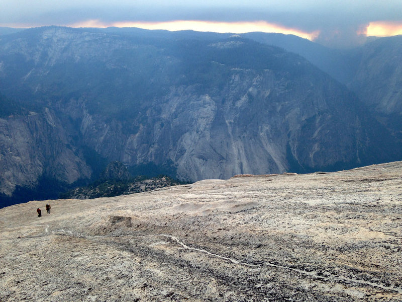 Coming up the slabs after the technical climbing was done. The smoke from the El Portal fire that started while we were up there is visible in the background.
